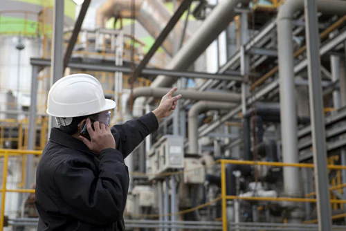 Engineer on a call at gas and chemicals plant