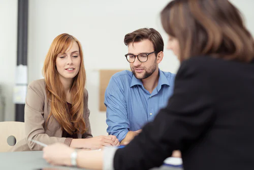 Lawyer explaining document to a couple