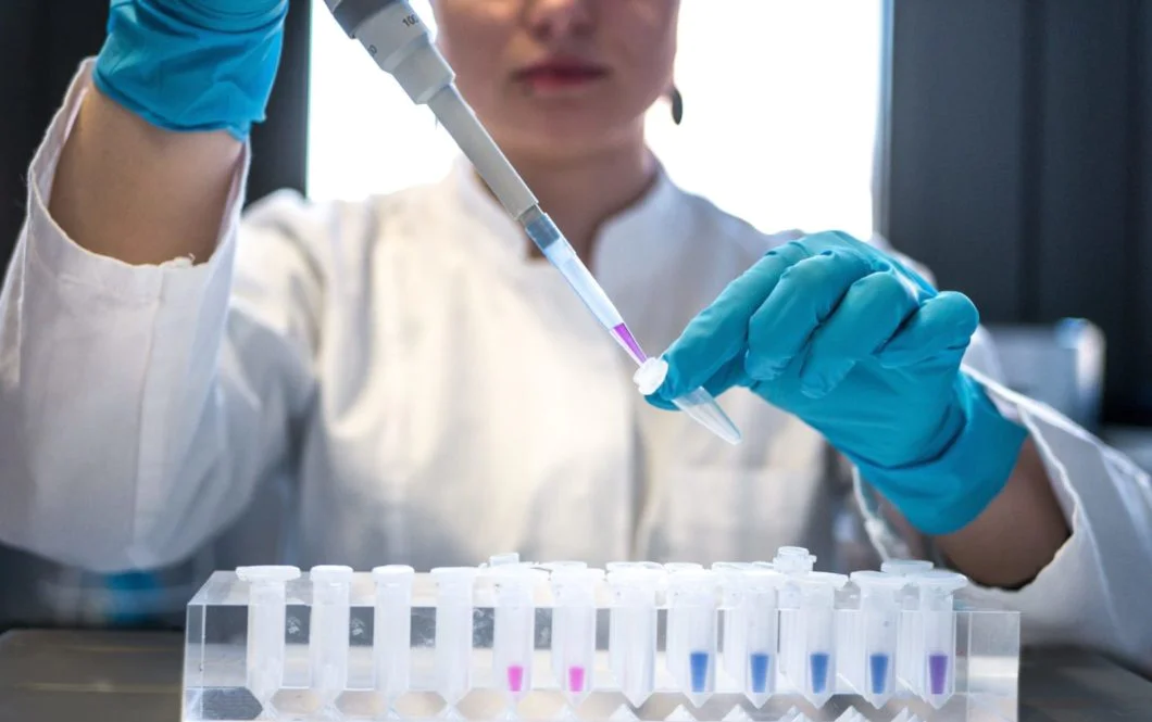 Human taking samples in lab