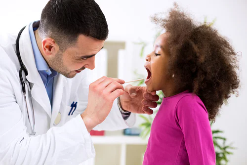 Doctor checking patient during appointment 